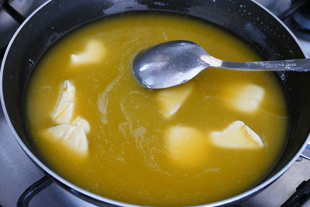 istock melted butter into the pan,use butter in meals, 1132110334