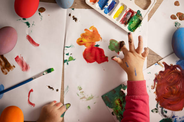 istock Creative girl enjoy in painting eggs 1132114445