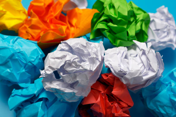 istock Multi-colored crumpled sheets of paper close-up. Texture background 1132115828