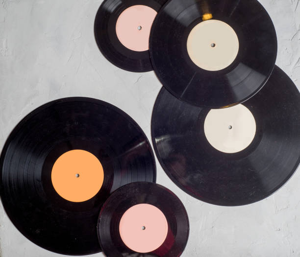 istock gramophone record of different sizes on a light background. View from above 1132115899