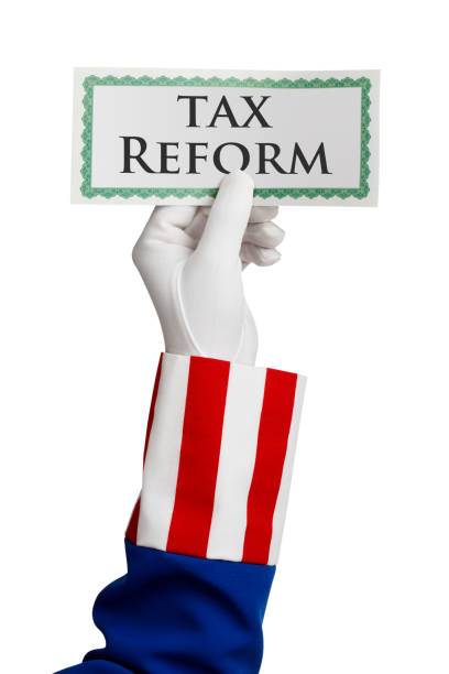 istock Uncle Sam Holding Certificate With Tax Reform Written On It 1132116884