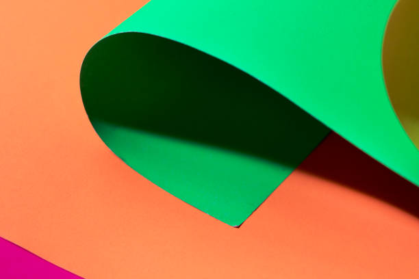 istock Neon pink,green and yellow Curled paper background. 1132117572
