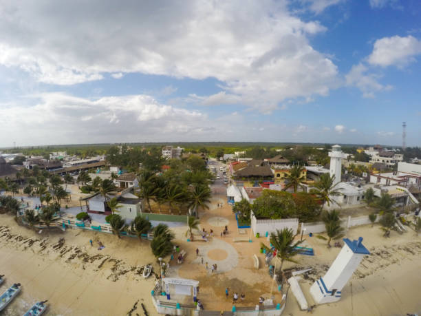 Aerial view on houses near to beach of Caribbean Sea in Puerto Morelos, Mexico. View on village from above Aerial view on houses near to beach of Caribbean Sea in Puerto Morelos, Mexico. View on village from above morelos state stock pictures, royalty-free photos & images