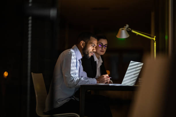istock Business People Working Late in The Office 1132119385