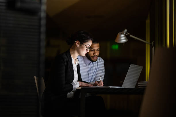 istock Business People Working Late in The Office 1132119640