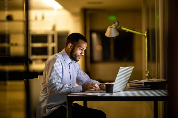 istock Overworked Businessman Working Late in The Office 1132120342