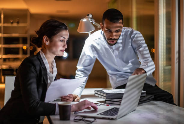istock Business People Working Late in The Office 1132120576
