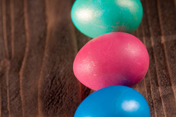istock Easter eggs on wooden planks 1132120991