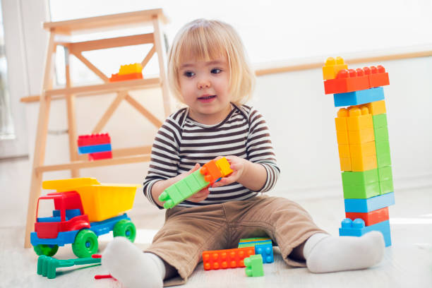 istock Little boy playing with colorful plastic blocks 1132121789