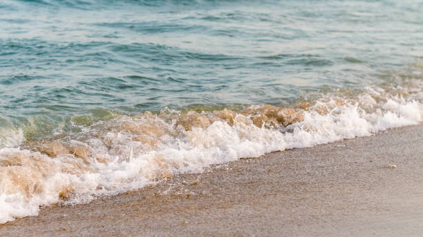 istock Seaside beach and soft blue sea wave. 1132123660