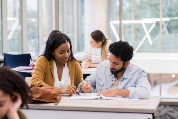 istock College couple study together in school library 1132123827