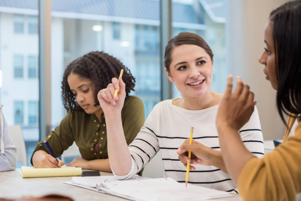 istock Young women enjoy studying in college library 1132123831
