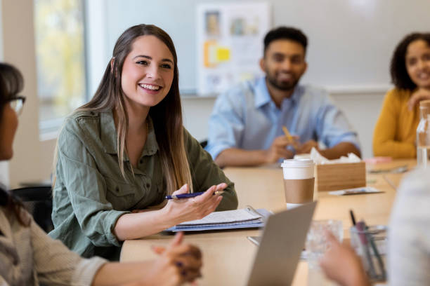istock Young design professional explains ideas to coworkers 1132123962