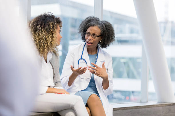 istock Doctor has serious conversation with female patient 1132124013
