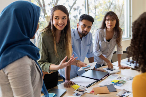 istock Young female creative professional presents ideas to manager 1132124541