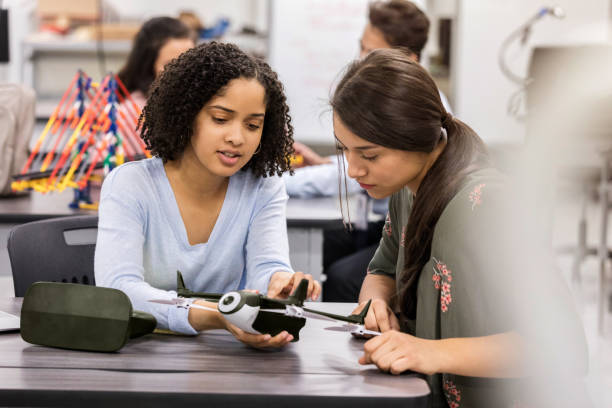 istock Female high school students build drone 1132124648