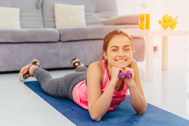 istock Young girl doing stretching exercise. At the same time getting a huge pleasure smiling. 1132127125