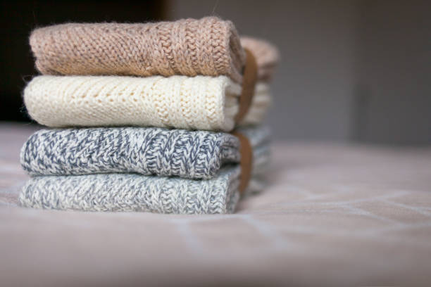 istock Woolen clothes on a home background. 1132127259