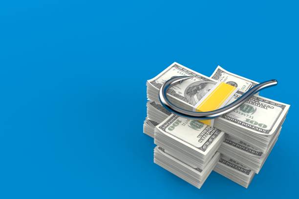 istock Fishing hook on stack of money 1132134684