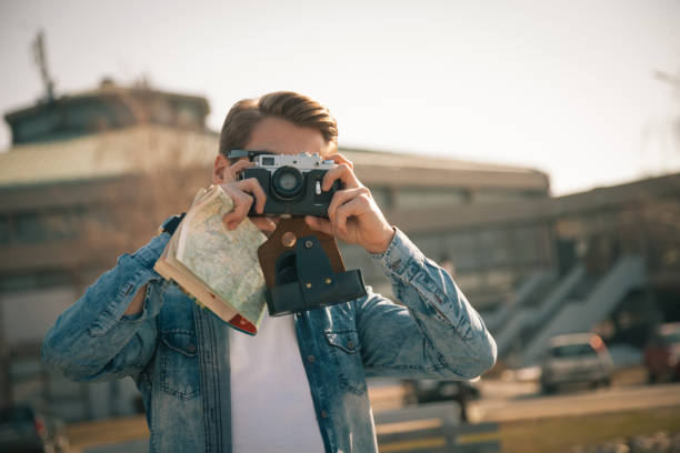 istock Tourist with retro camera 1132135692