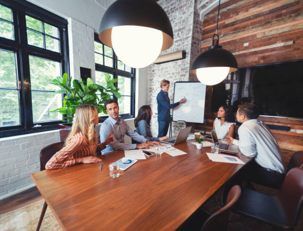 istock Business people watching a presentation on the whiteboard. 1132135986