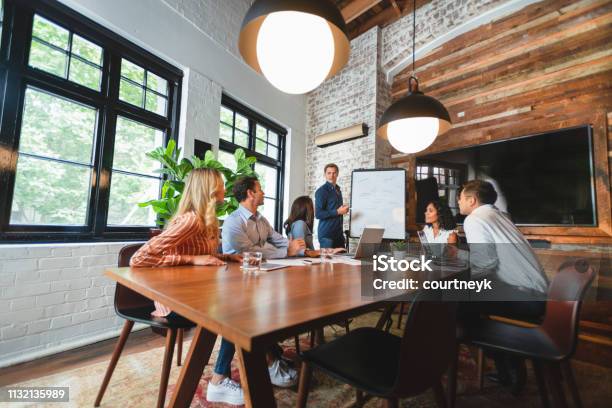 Business People Watching A Presentation On The Whiteboard Stock Photo - Download Image Now