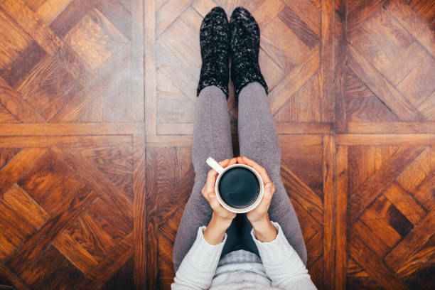 istock Young woman in cozy home clothes relaxing 1132144506