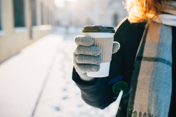 close-up female's hand in warm glove - people cold frozen unrecognizable person imagens e fotografias de stock