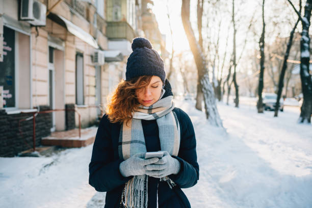 istock Young woman wearing warm scarf 1132144548