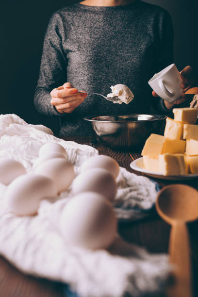 istock Young woman cooking dough for pie 1132144565