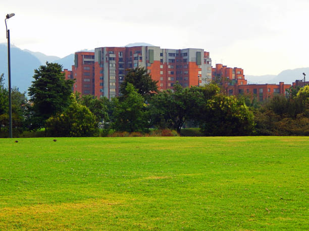 istock Green garden with building and mountains in the back 1132146437