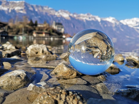 Crystal ball on the lake shore during day time