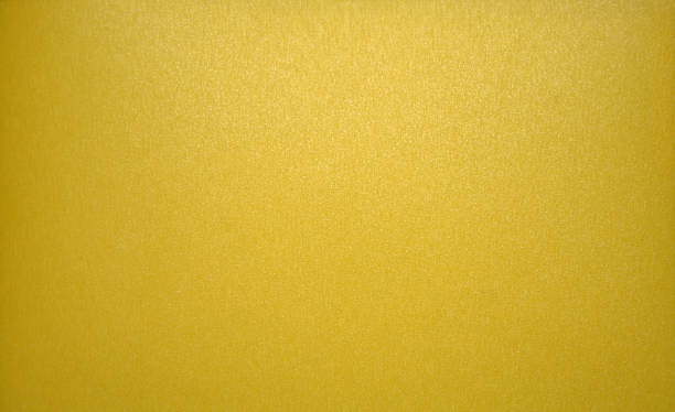 istock Yellow monochrome glossy background. Close-up. 1132147492