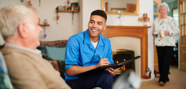 istock care nurse with rehabilitating senior man 1132148246
