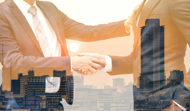 istock Businessmen making handshake business etiquette on white 1132151645