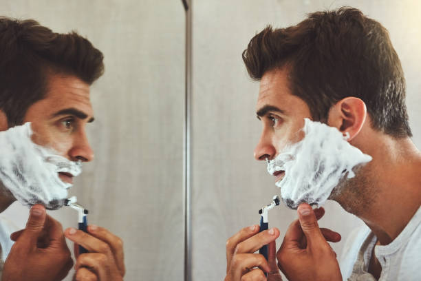 nice and close - shaving men shaving cream mirror imagens e fotografias de stock