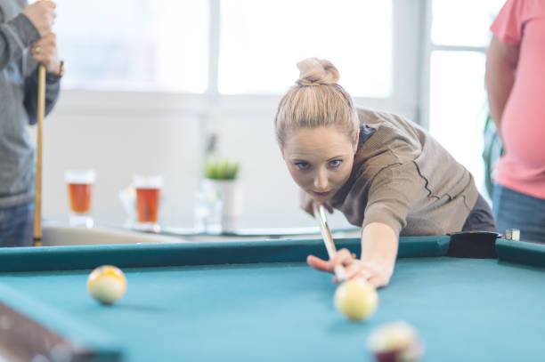 istock Friends hang out and play some pool together 1132154572