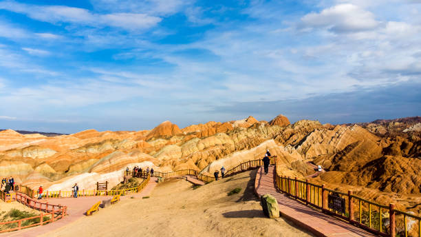 istock Viewing Platform and Chinese Tourists. Rainbow Mountains Geological Park Zhangye Danxia 1132156868