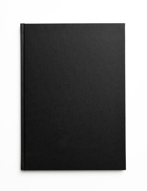 白い背景に閉じた黒い本の孤立したショット - book black isolated on white note pad ストックフォトと画像