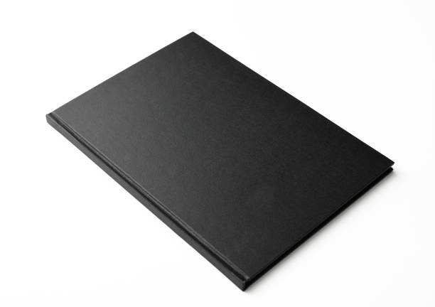 istock Isolated shot of closed black book on white background 1132160194