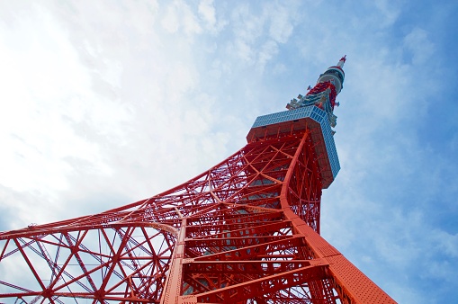 The iconic Tokyo Tower against an early morning blue sky in Japan.