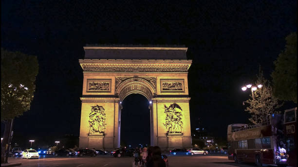 istock night view of the arc de triomphe de l'etoile, paris 1132163728