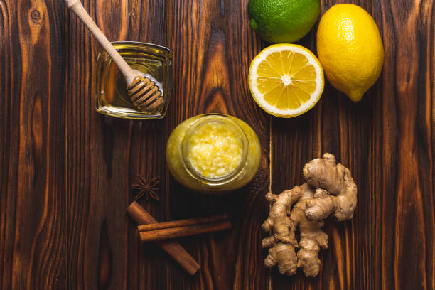 istock Ginger, lemon, honey, cinnamon on a dark wooden background 1132168225