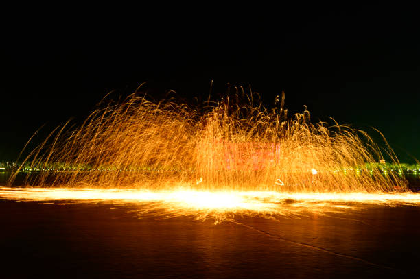 istock Molten steel in the high temperature melt splashing sparks 1132174591