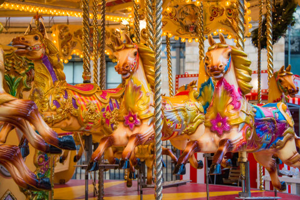 colorful horse carousel at an amusement park. - carnival amusement park amusement park ride traditional festival imagens e fotografias de stock