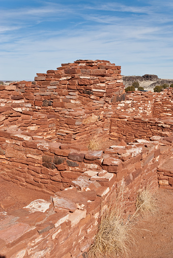 Nearly a thousand years ago natives inhabited the plains between the Painted Desert and the San Francisco Peaks of Arizona. In an area so dry it would seem impossible to live, they built pueblos, harvested rainwater, grew crops and raised families. Today the remnants of their villages dot the landscape. Nalakihu Pueblo is in Wupatki National Monument, established in 1924 to preserve this rich heritage. Wupatki National Monument is near Flagstaff, Arizona, USA.