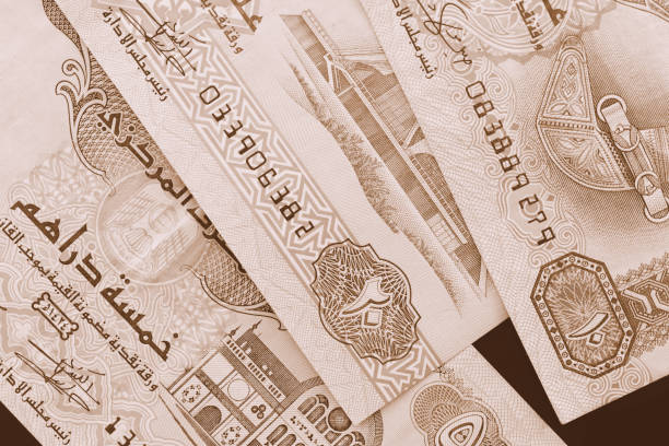 istock UAE dirham currency background close up. Brown color toned 1132181939