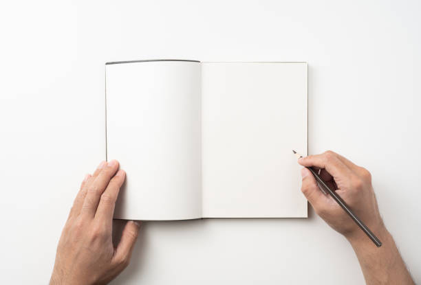 man hand hold brown notebook and pen on white