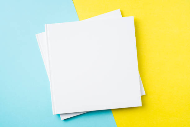 istock two white square notebook on yellow and blue paper 1132183010