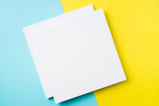 istock two white square notebook on yellow and blue paper 1132183019